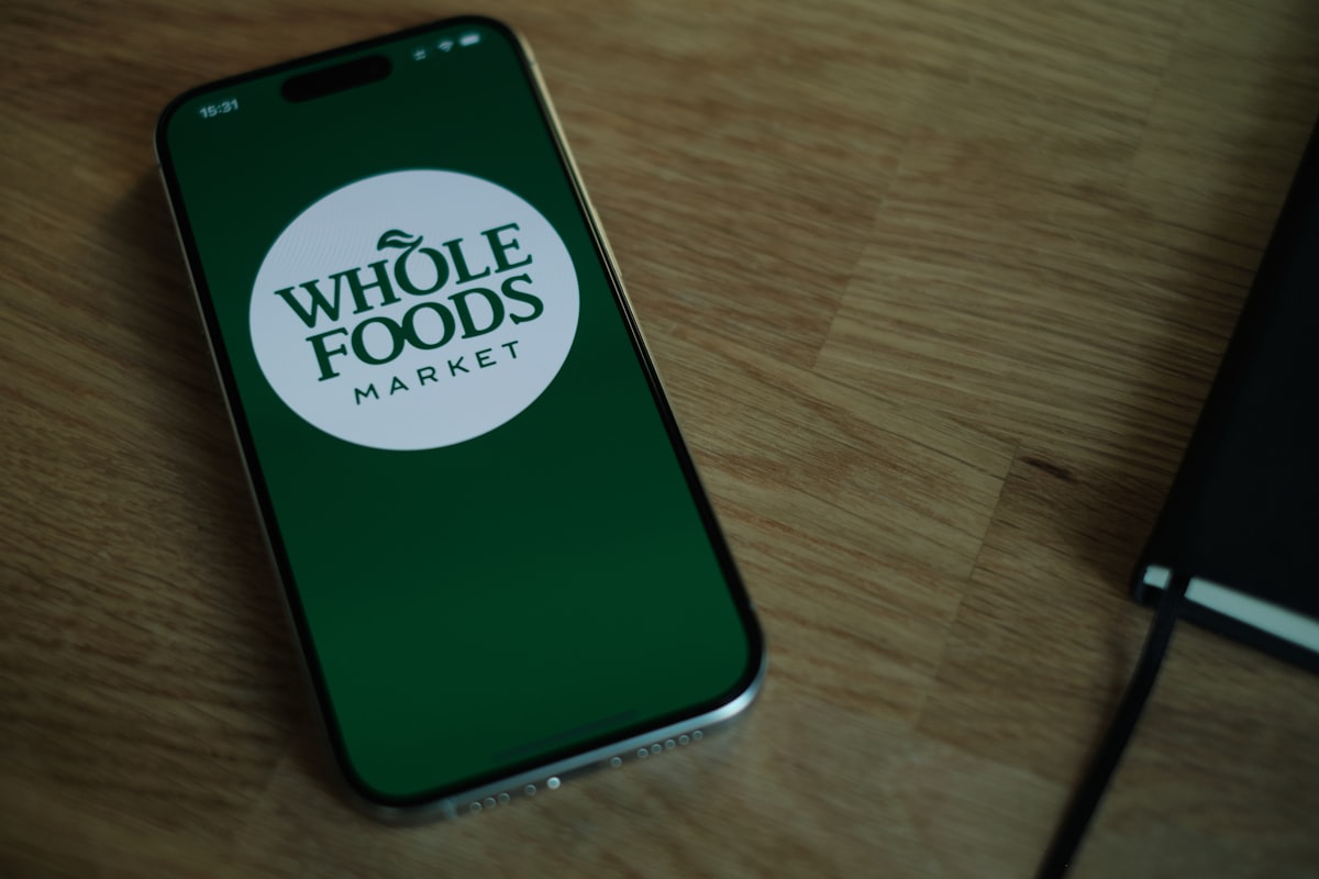 Natural whole foods and vegetables on wooden surface